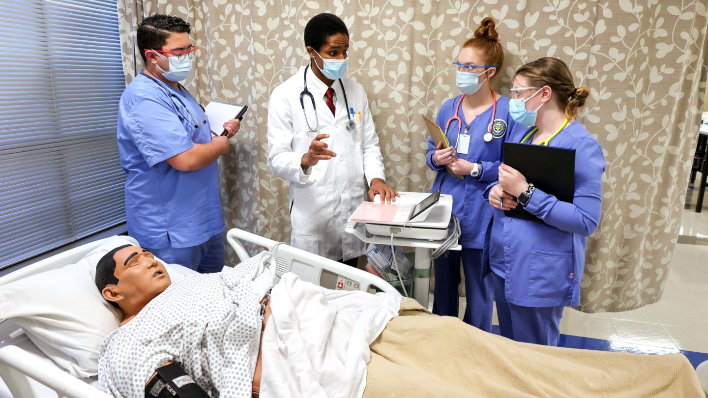 Students practice performing a 12-Lead EKG at the bedside with Dr. Reynolds.